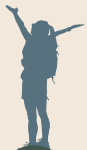 women on a mountain top with arms spread wide
